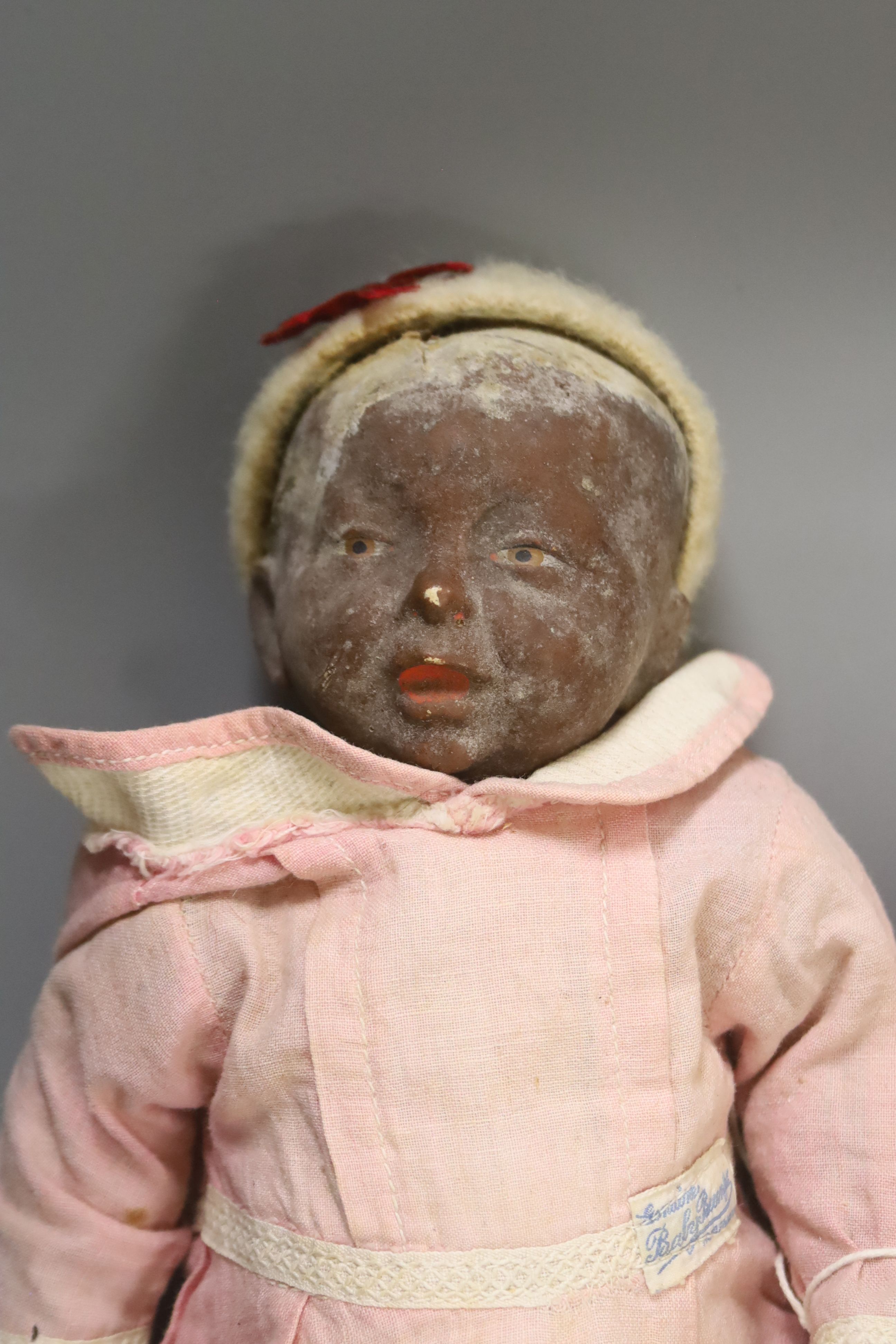 A collection of four dolls including an AM bisque head doll, height 38cm